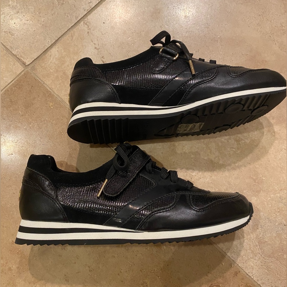 Michael Kors low top blk and gold sneakers.